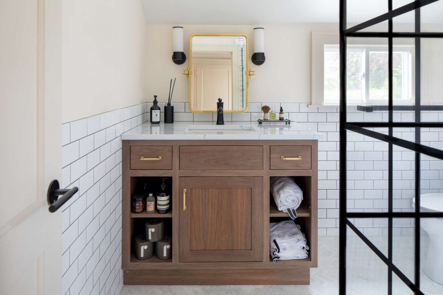 Wooden bathroom cabinet with white tiles