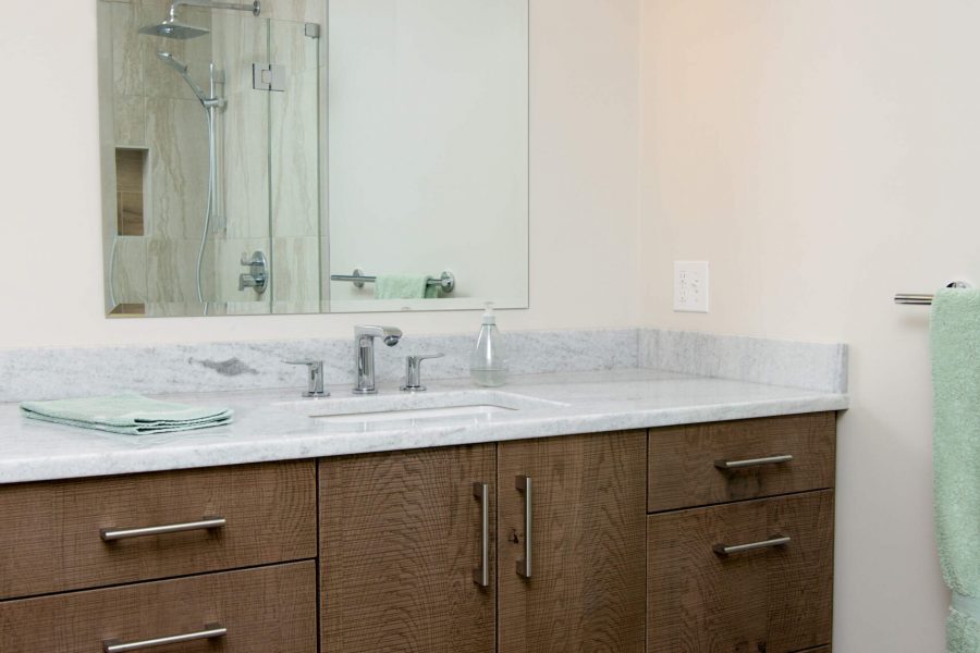 brown bathroom cabinet with white interior