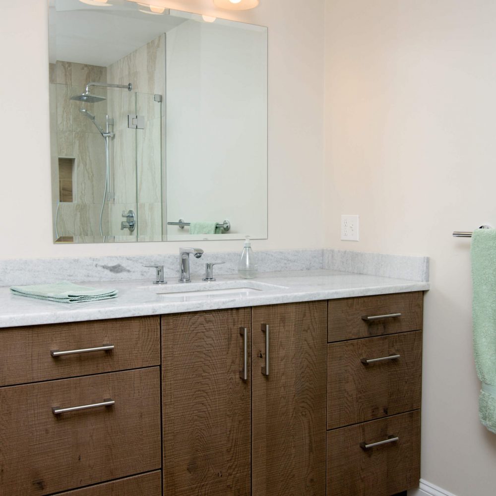 brown bathroom cabinet with white interior