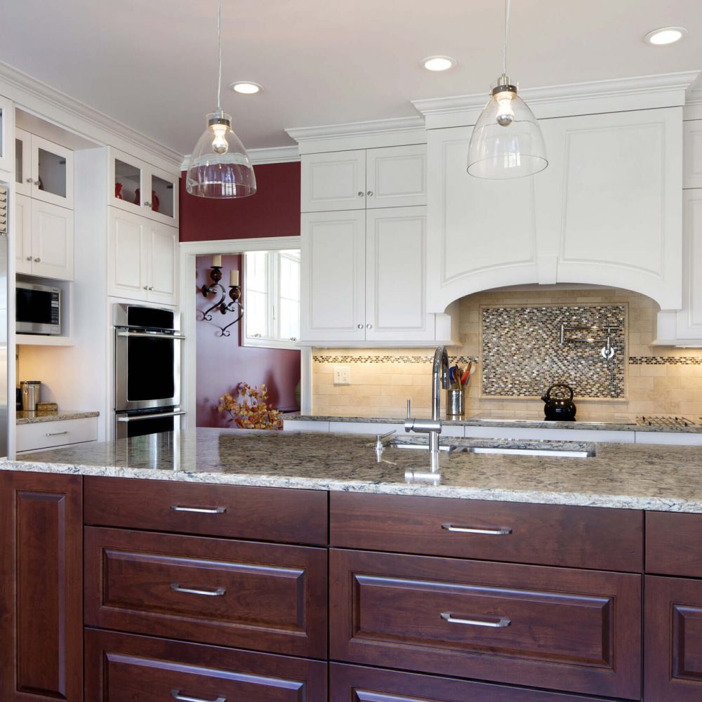 dark mahogany cabinet with light brown stone countertop